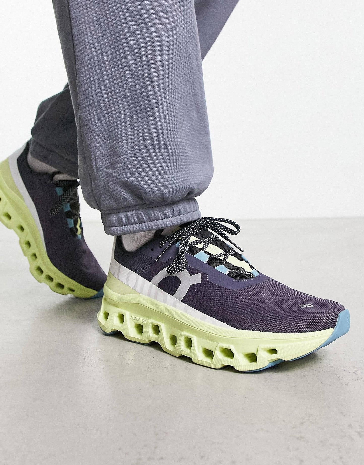 On Running Cloudmonster trainers in purple and green K